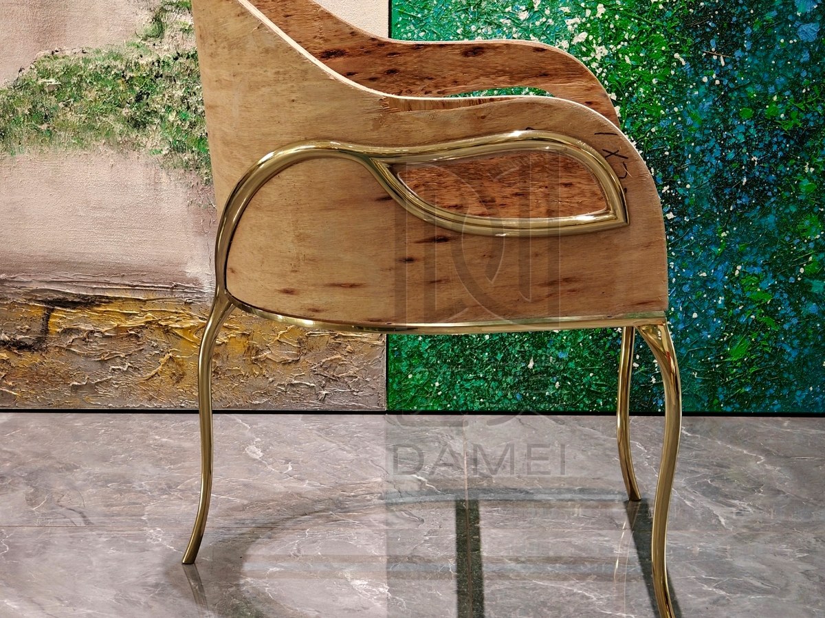 Bent plywood dining chair shell combined with a curved metal frame.