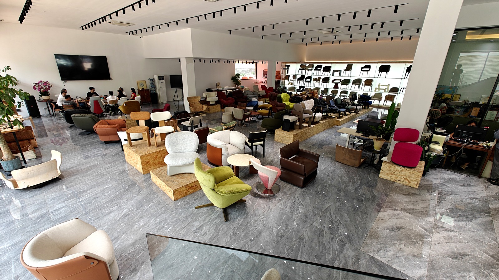 DALI showroom displaying curved plywood components and dining chair development options.
